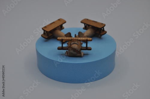 Close up creative shots of small wooden plane models handcrafted from wood, around 3cm X 2cm in size photo