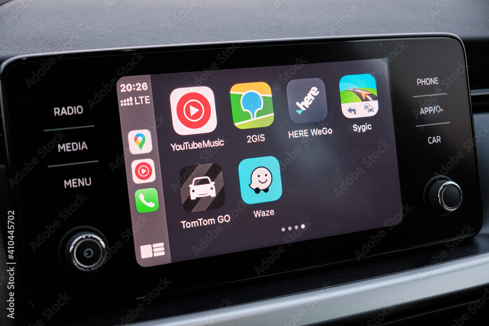 Apple CarPlay screen in the car dashboard. Youtube music, Waze, 2GIS, Here  WeGo, Sygic, TomTom Go logo on the screen in the automobile, August 2020,  San Francisco, USA Photos | Adobe Stock