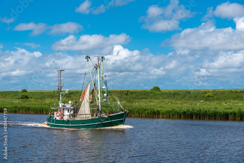 Shrimp boats in the Leyhoerner-Sieltief bei Greetsiel photo