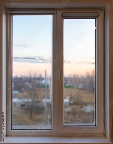 Window in the room at home as a background. Winter