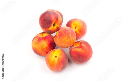 Summer fruit background. Ripe juicy peaches on white background. Copy space. Fresh organic fruit vegan food. Harvest concept