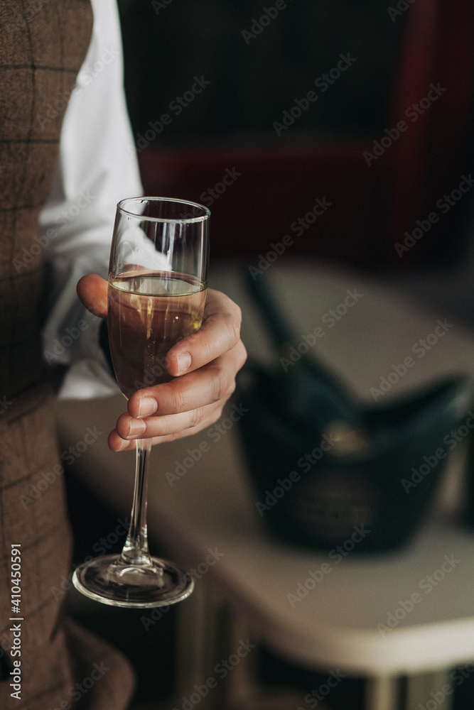 a glass of champagne in the hand of a brutal man a glass of champagne in the hand of a brutal man