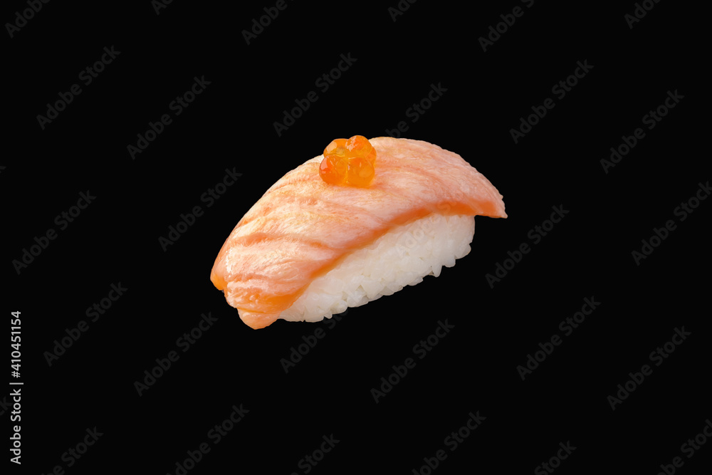 Nigiri sushi with fried salmon medium, red caviar, on a black background