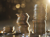 Close up of coins to stack of coins background