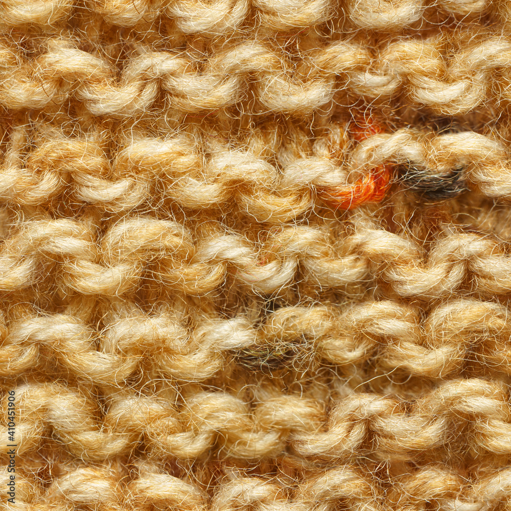 Brown yellow beige color knitted fabric seamless pattern for borderless fill. Knitted fabric repeating pattern for background close up. Brown yellow beige color knitted fabric seamless pattern for borderless fill. Knitted fabric repeating pattern for background close up.