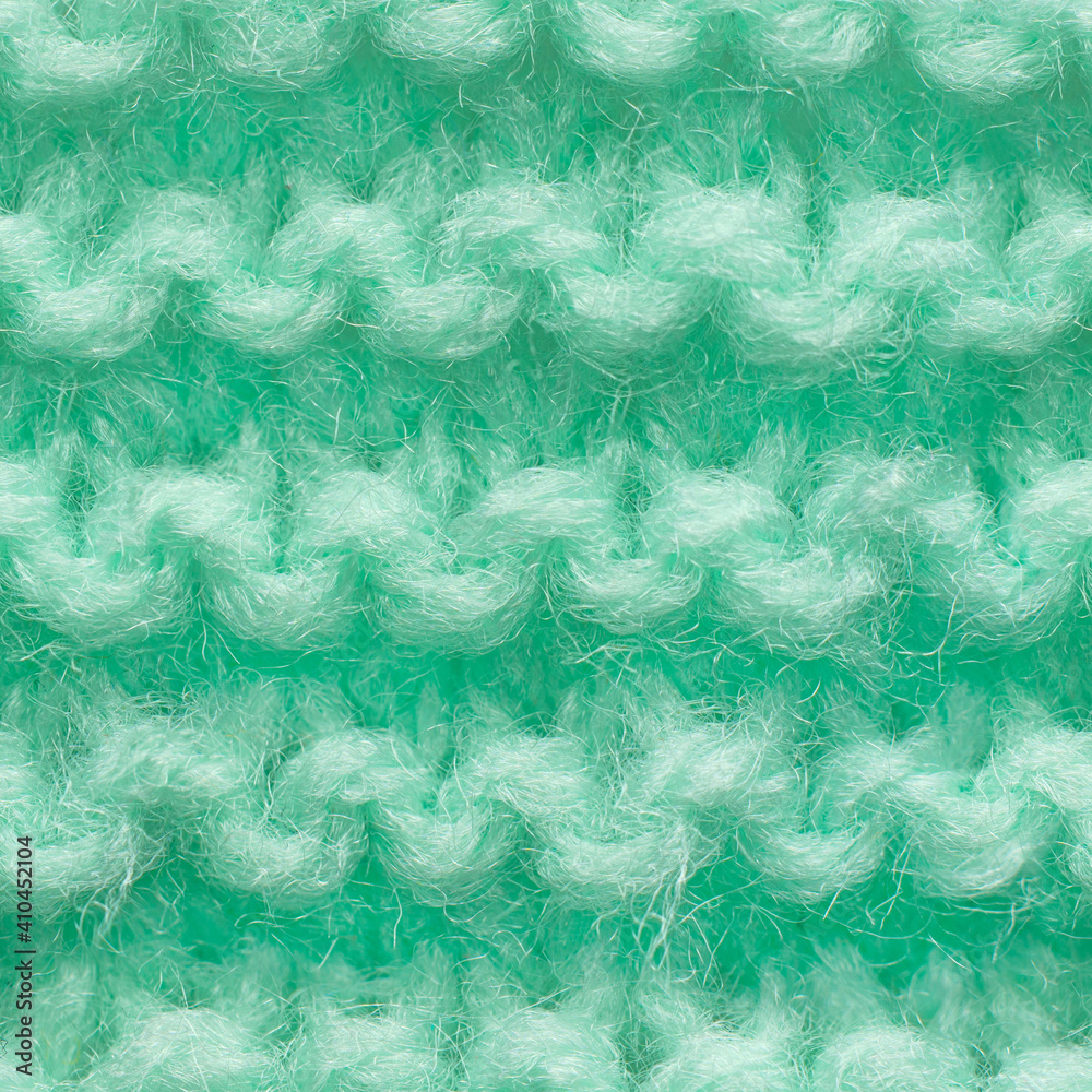 Turquoise, mint color knitted fabric seamless pattern for borderless fill. Knitted fabric repeating pattern for background close up.