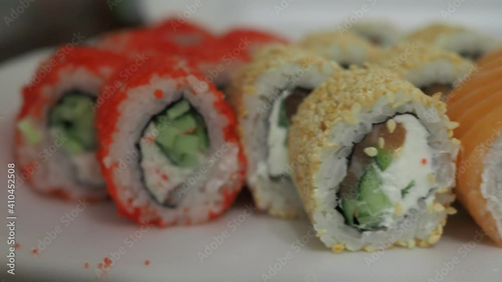 sushi with red fish, sesame seeds and cheese. japanese cuisine.