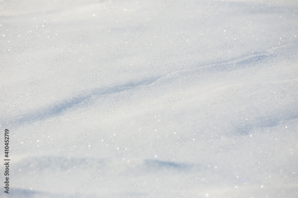 white snowdrift with blue shadows, winter texture