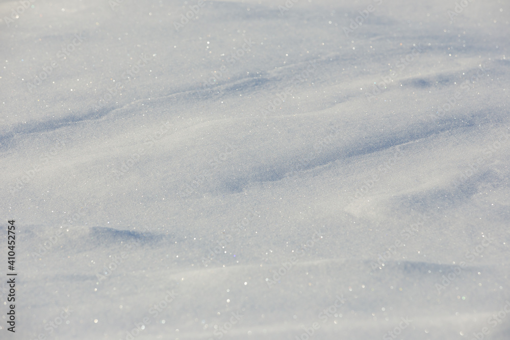white snowdrift with blue shadows, winter texture