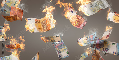 Burning Euro banknotes falling down photo