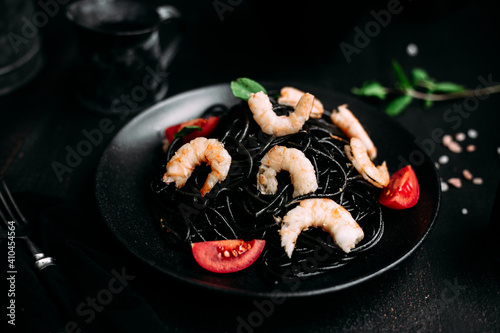 Black pasta with tiger prawns