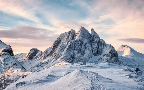 Fototapeta Naklejka Na Ścianę i Meble -  Scenery of Majestic snow mountain with footprint on Segla hill in the morning at Senja Island