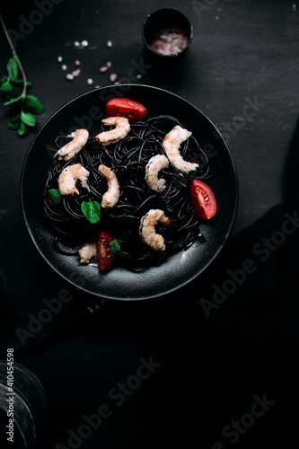 Black pasta with tiger prawns