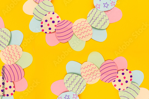 easter background with easter wreath on yellow background