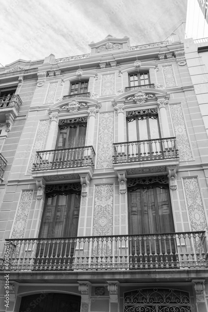 Castellón de la Plana, Valencian Community, Spain (Costa del Azahar). Beautiful historical appartment facade. Monochrome photography (black and white). Vertical shot.