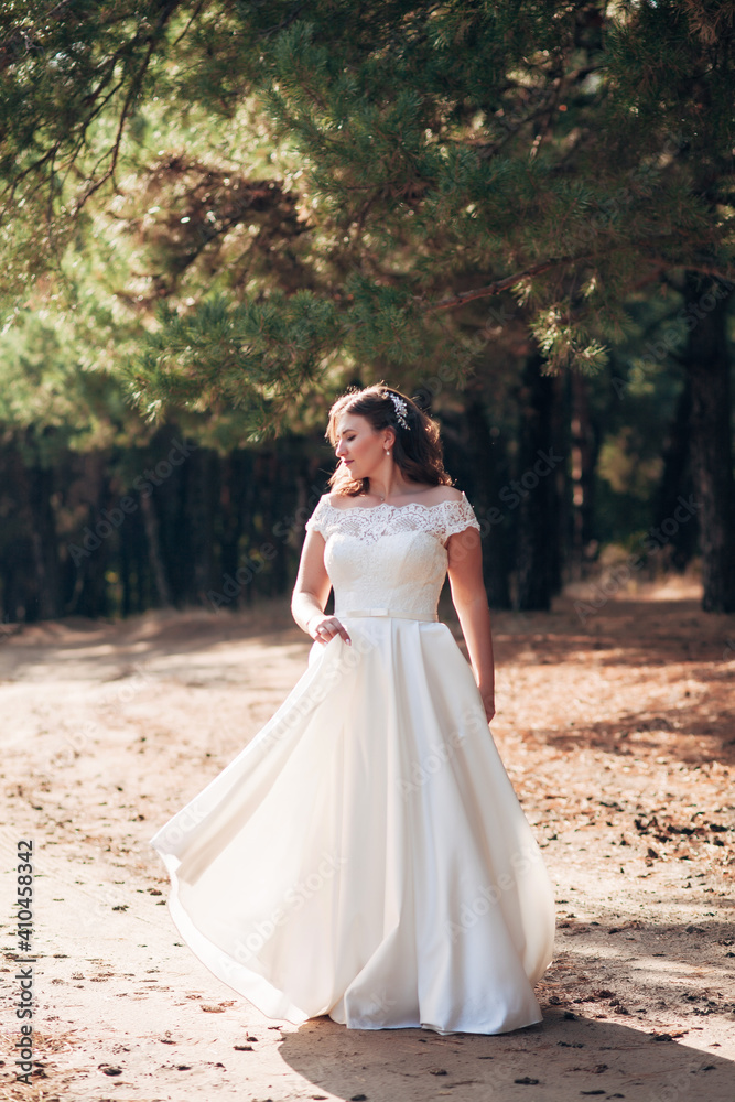 
bride walking on a sunny day