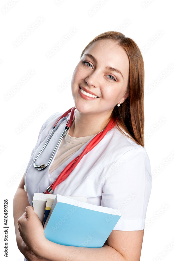 young woman doctor in a medical gown with a phonendoscope smiling cute on a white isolated background. doctor pediatrician