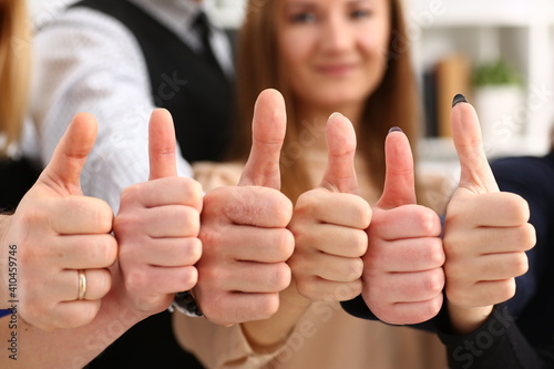 Group of people show OK or confirm with thumb up during conference closeup. High level quality product serious offer mediation solution happy client creative advisor participation concept