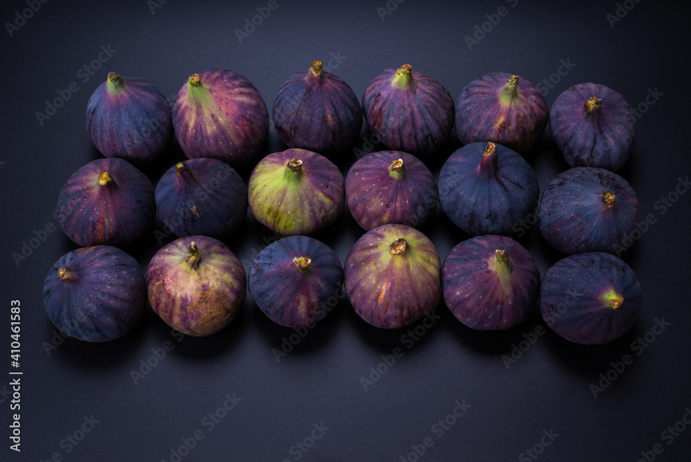Tasty figs on a black background. Top view. Tasty figs on a black background. Top view.