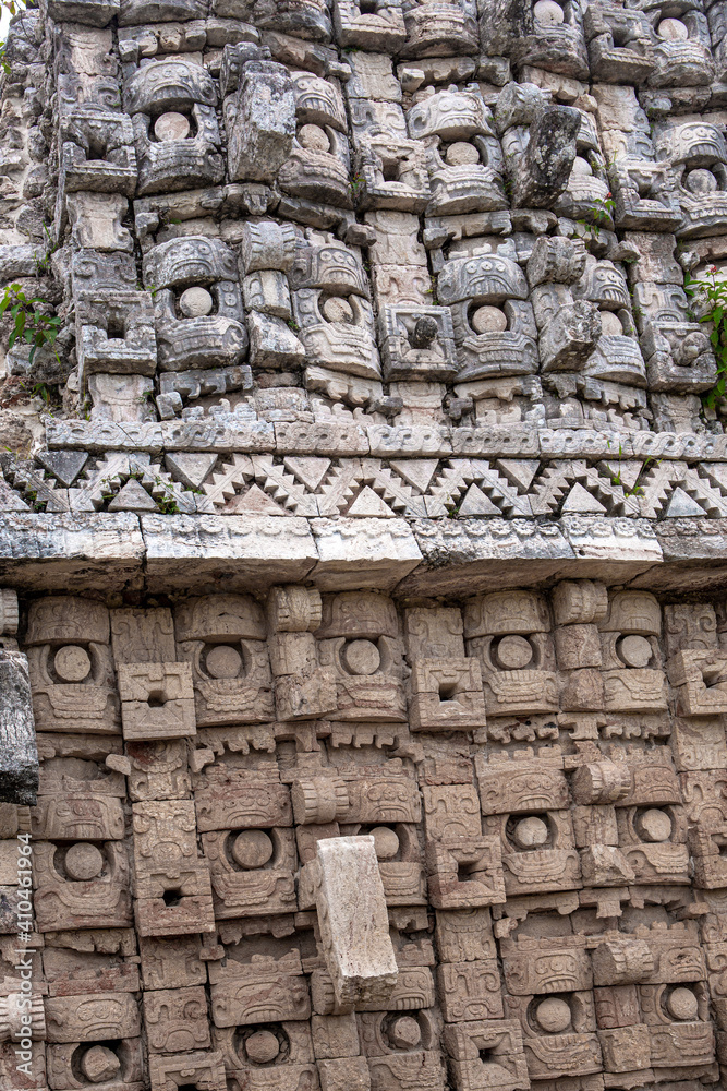 ancient mayan face stone wall