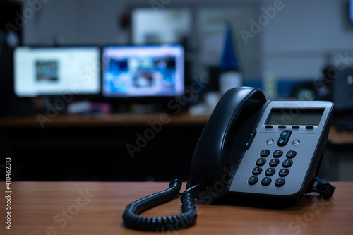 Foto IP telephone device on wooden table in office room