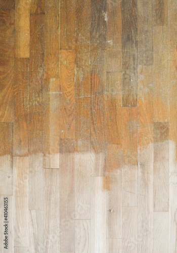 Konstfotografi Wood floor that is being refinished, sanded floor on bottom and original floor o