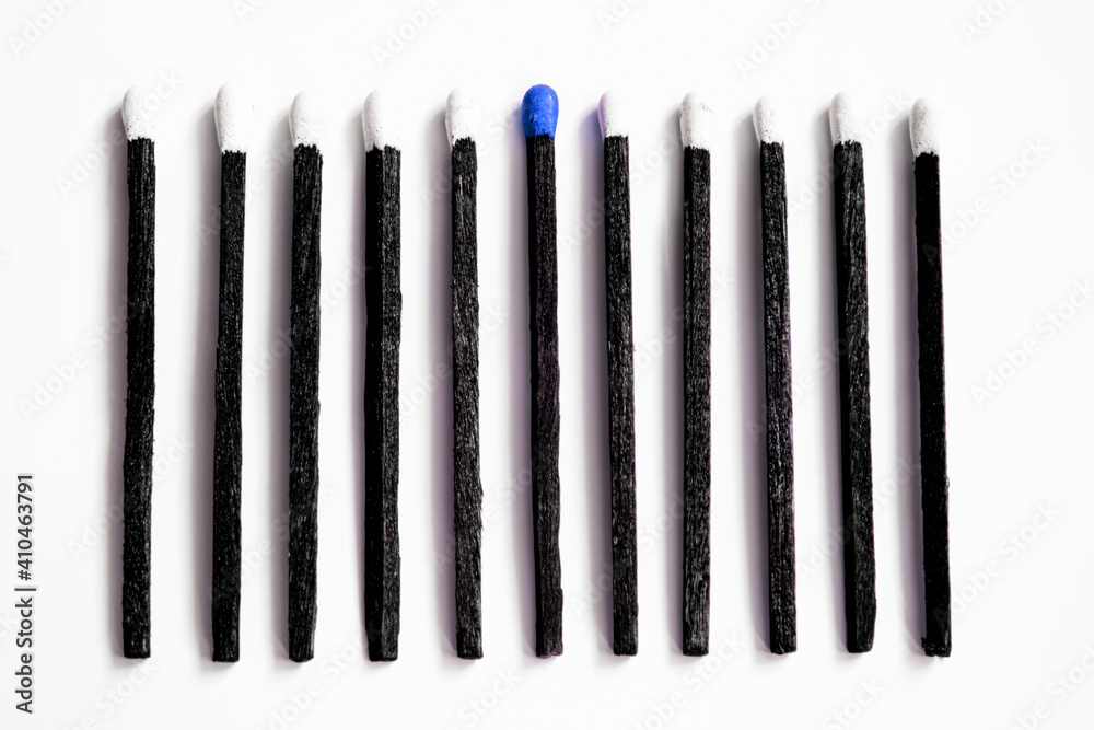 black matches with white heads and one with red head isolated over white black matches with white heads and one with red head isolated over white