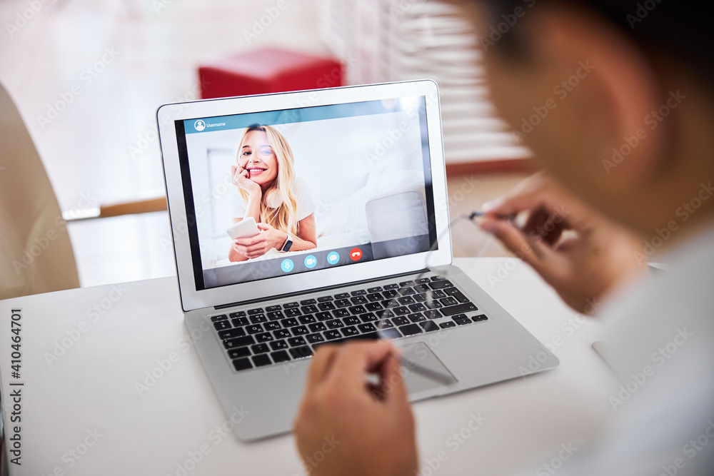 Female client consulting a male optician online Female client consulting a male optician online