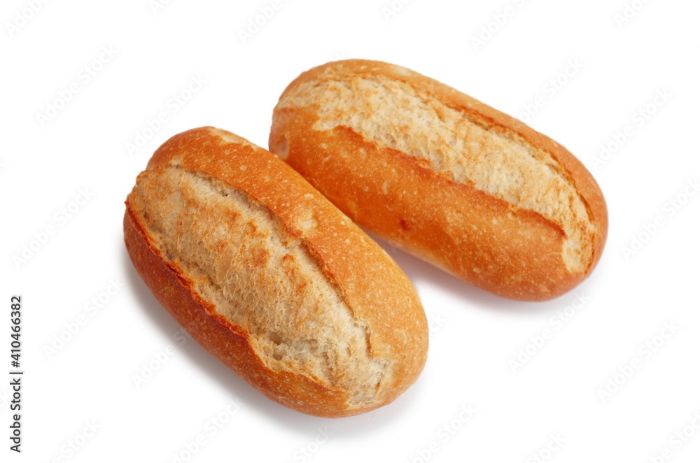 Two fresh crusty mini baguettes isolated on white bacground. Small baguette rolls. Food and breakfast background. Worldwide hunger concept. Two fresh crusty mini baguettes isolated on white bacground. Small baguette rolls. Food and breakfast background. Worldwide hunger concept.