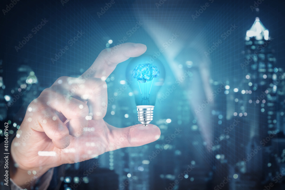 Light bulb with brain inside the hand of the businessman as business idea concept. Light bulb with brain inside the hand of the businessman as business idea concept.