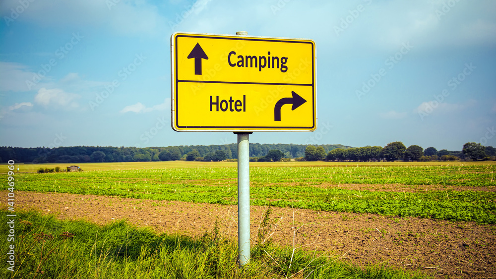 Street Sign to Camping versus Hotel