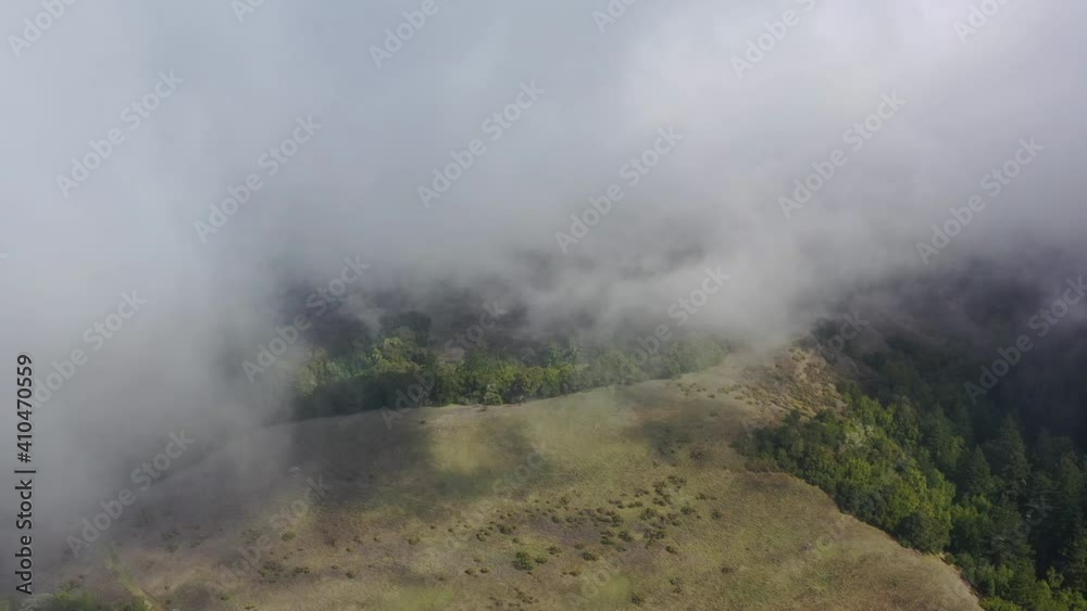 Clouds drift across a beautiful forested landscape near Santa Cruz, California. This coastal, mountainous region, south of San Francisco, harbors vast forest tracts. Clouds drift across a beautiful forested landscape near Santa Cruz, California. This coastal, mountainous region, south of San Francisco, harbors vast forest tracts.