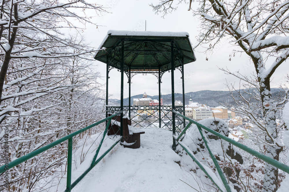 Stunning scenic view of beautiful cityscape of medieval Loket nad Ohri town with Loket Castle gothic style on massive rock, colorful buildings during winter season, Karlovy Vary Region, Czech Republic
