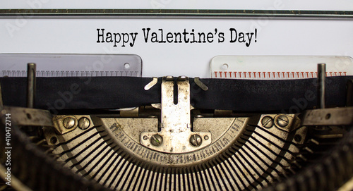 February 14 valentines day symbol. Words 'Happy Valentines day' typed on retro typewriter. Beautiful background, copy space. February 14 Valentines day concept.