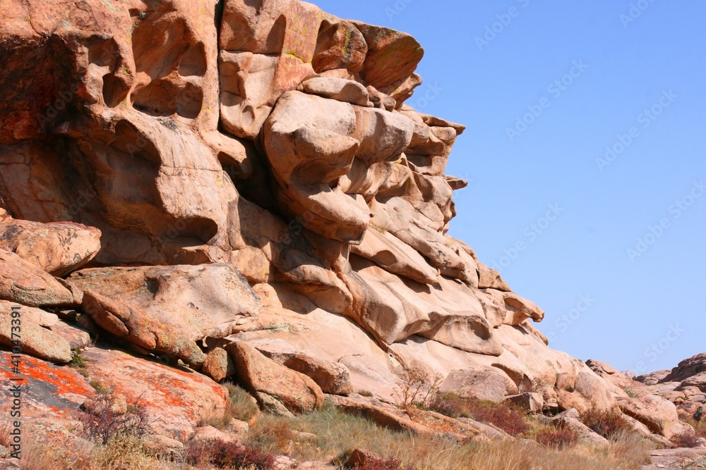 Bektau-Ata Tract. Bektau mountains. Rock formations in Bektau Ata in Kazakhstan in summer. Desert mountains Bektau-Ata. Focus on mountains. Landscape of the gorge and rocks. 
