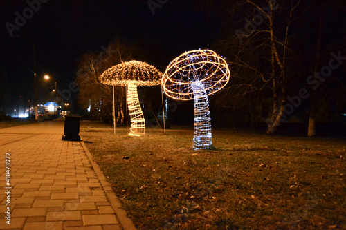 glowing mushrooms on the night street © arkadiy