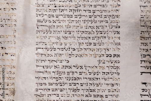 Old Bible scrolls lie on a black background. Religion. Bible. Bible books. Christianity. God. Hebrew. Old chronicles. Israel. Jerusalem.