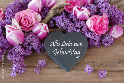 Geburtstagskarte, Herz mit Schriftzug alles Liebe zum Geburtstag mit Tulpen Rosen und Flieder photo