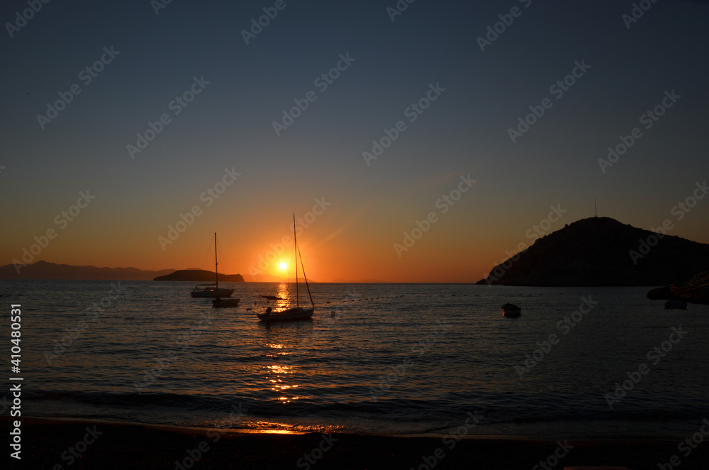 Sunset on a beach overlooking the Mediterranean. Sunset from a beach in the Aegean Sea.