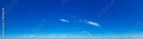 Blue Sky background with tiny Clouds. Panorama background