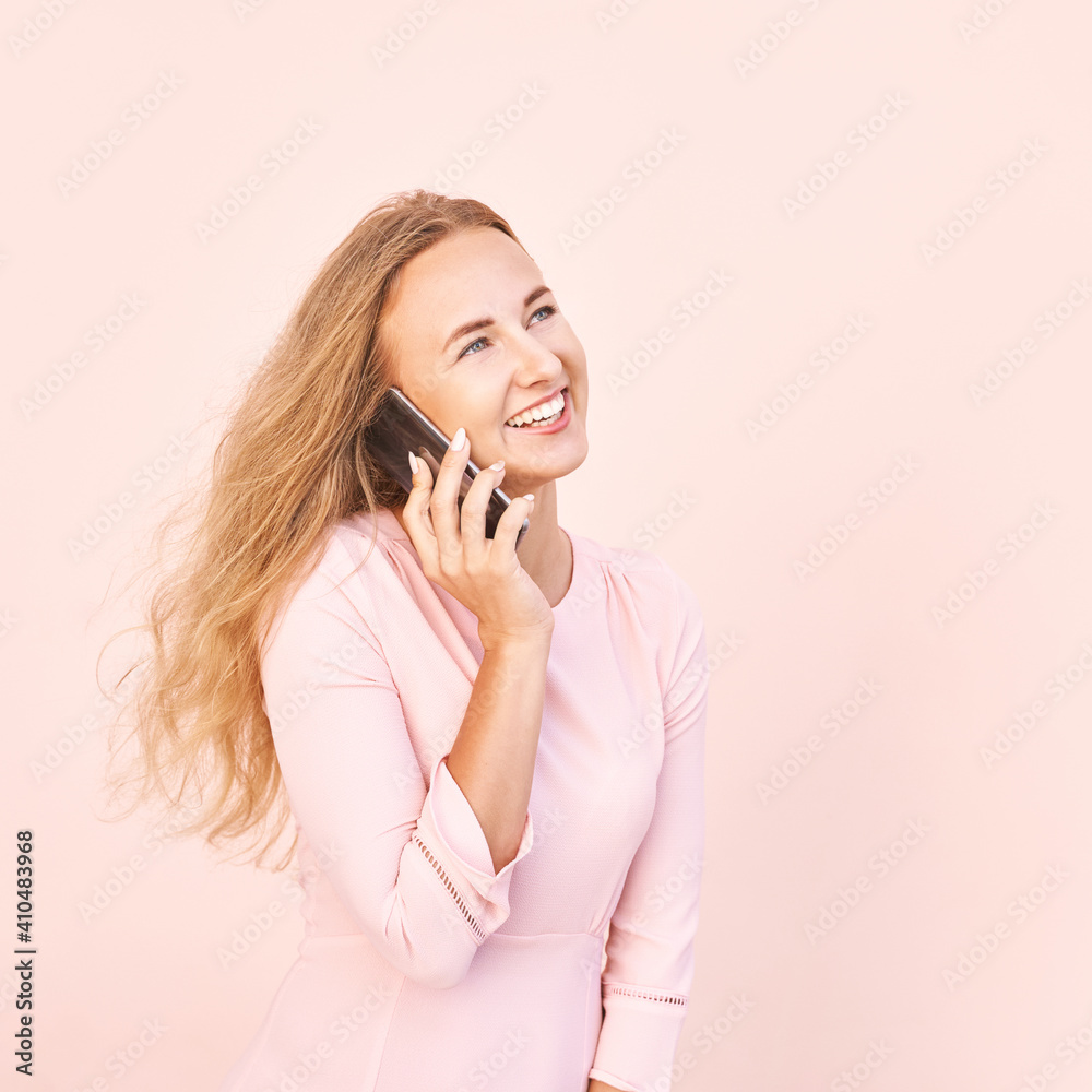 Pretty young woman talking by phone. Happy female person outdoors. Summer business portrait. Lady calling friends or boyfriend. Blonde long hair. Cute adult student at town Pretty young woman talking by phone. Happy female person outdoors. Summer business portrait. Lady calling friends or boyfriend. Blonde long hair. Cute adult student at town