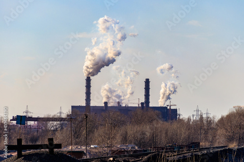 View of old factory with pipes with smoke. Air pollution  environmental damage