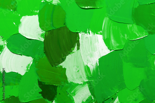 Green background from smeared paints on canvas. St.Patrick 's Day. Green contrast background of oil paints