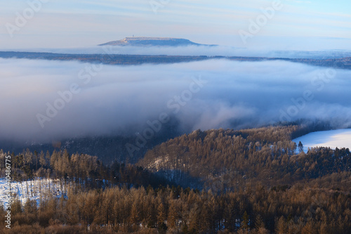 Winter cold weather in mountains, colorful fog