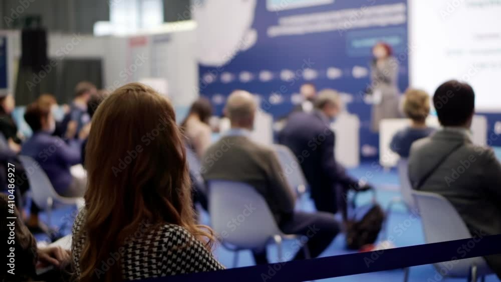 A woman attends a business presentation. A woman attends a business presentation.