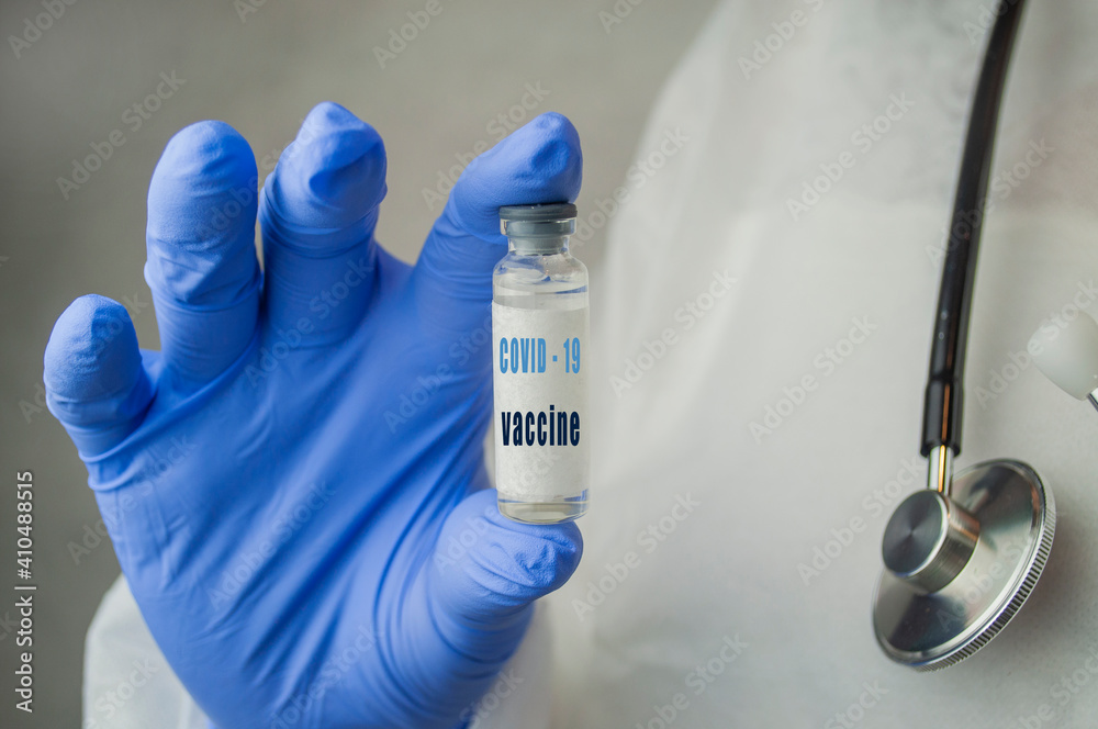 Fototapeta premium medicine vaccine in a bottle in the doctor's hand for coronavirus pneumonia disease
