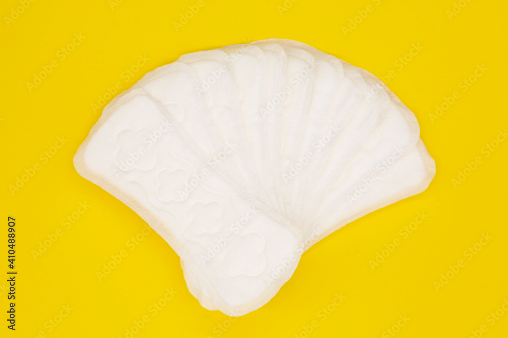 sanitary napkin or sanitary pad for intimate hygiene on a yellow background sanitary napkin or sanitary pad for intimate hygiene on a yellow background