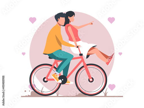 Happy couple is riding a bicycle together