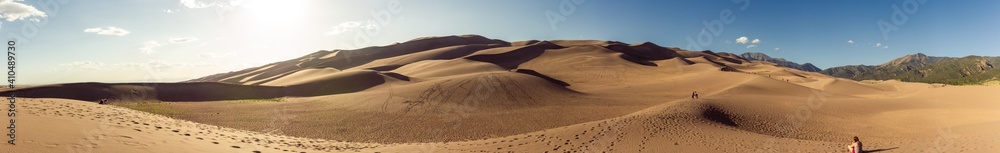 Panorama shot of sandy dunes in great sand dunes national park at sunny day in america