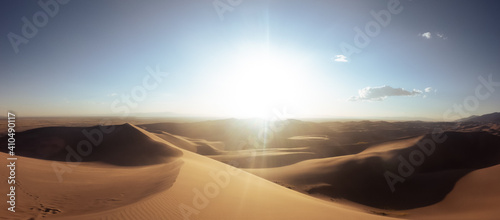 Panorama of sandy dunes with sun rays at sunset  in great sand dunes national park in america